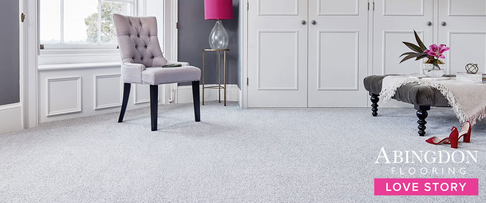 A plush silver carpet in a bedroom